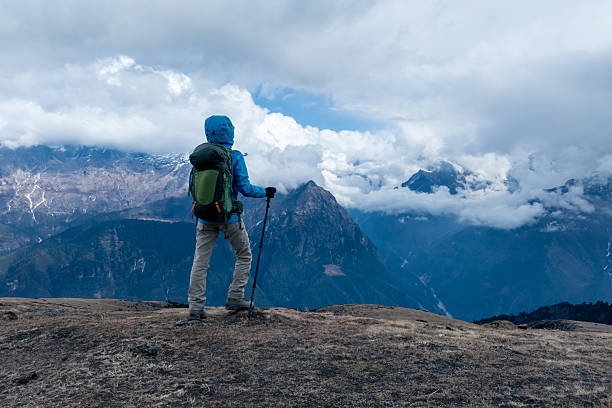 istock Backpacking woman hiking on high altitude mountain top 2235861699