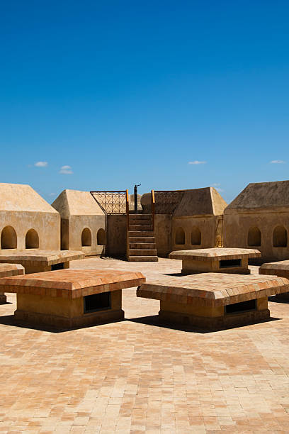 istock Boxy architecture on a historic roof in Morocco under blue skies 2235862983