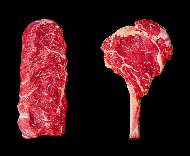 istock Detailed display of fresh beef cuts arranged on a black background 2235863119