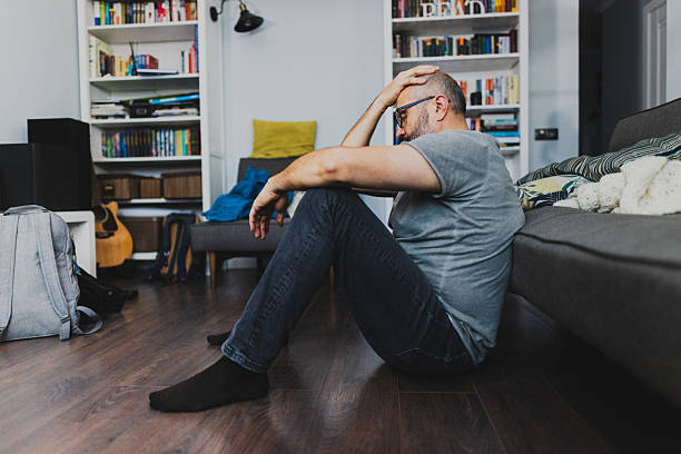 istock Thoughtful Elderly Man Sitting at Home in Deep Contemplation. Life Problems Concept 2235863365