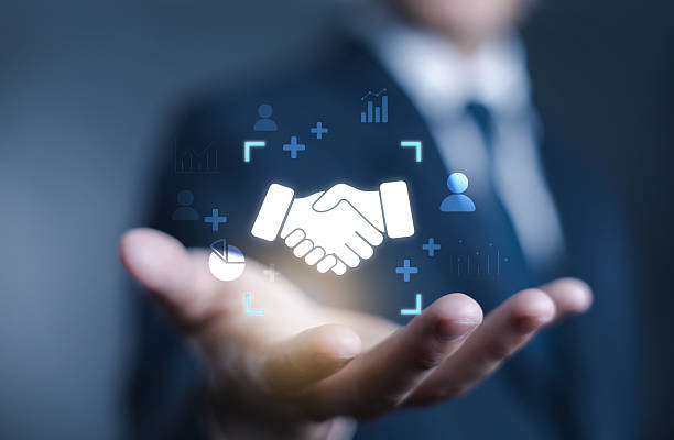 istock Businessman hand holding digital handshake icon, representing partnership, trust, collaboration, agreement, teamwork, corporate relationship, and successful business deal in modern marketing. 2235864080