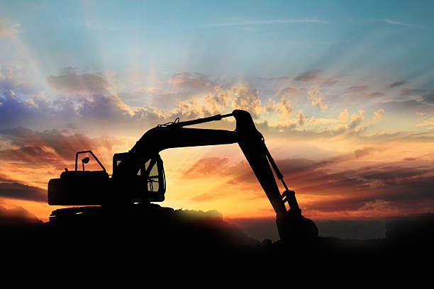 istock Crawler excavators silhouette are digging the soil. 2235864496