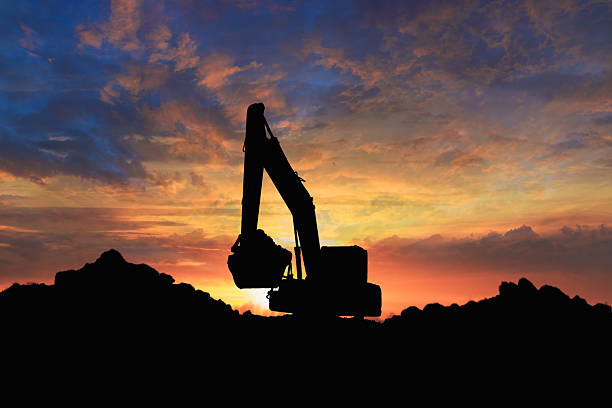 istock Crawler excavator  silhouette are digging the soil in the construction site  . 2235865085
