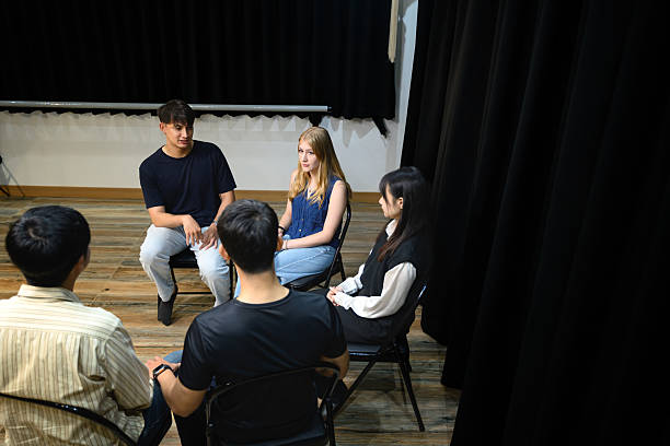 istock Support group meeting where participants engage in open discussion for mental health and recovery 2235865654