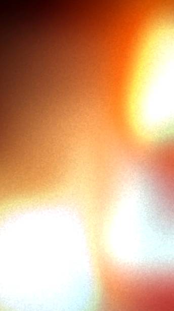 istock Abstract blend of warm and cool colors with a bright light source and grainy texture creating a soft gradient effect 2235867300
