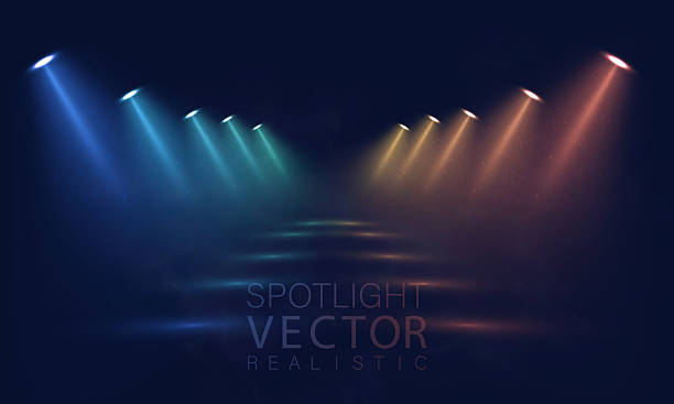 istock Bright luminous stage spotlights with radiant glowing beams and shining brilliance for concert, theater, or decorative abstract design. 2235869009