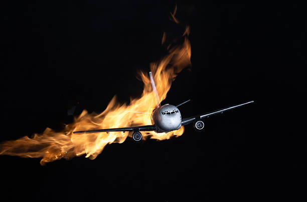 istock burning airplane isolated on black background 2235869077