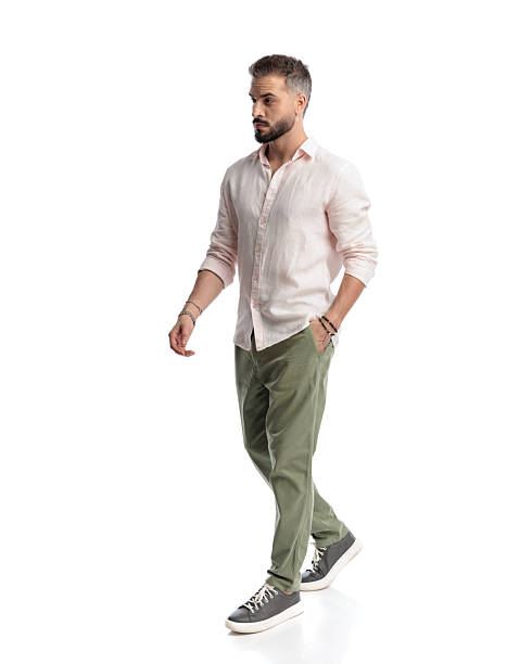 istock side view of bearded young man looking to side and walking 2235871492