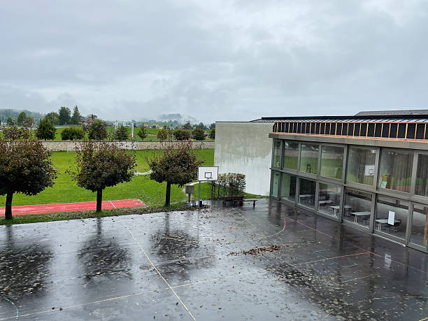 istock School courtyard in Einsiedeln, Switzerland on a rainy day with surrounding greenery 2235871559