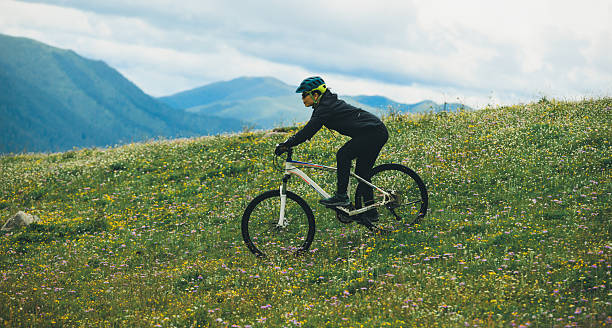 istock Riding mountain bike on beautiful forest mountain top 2235871581