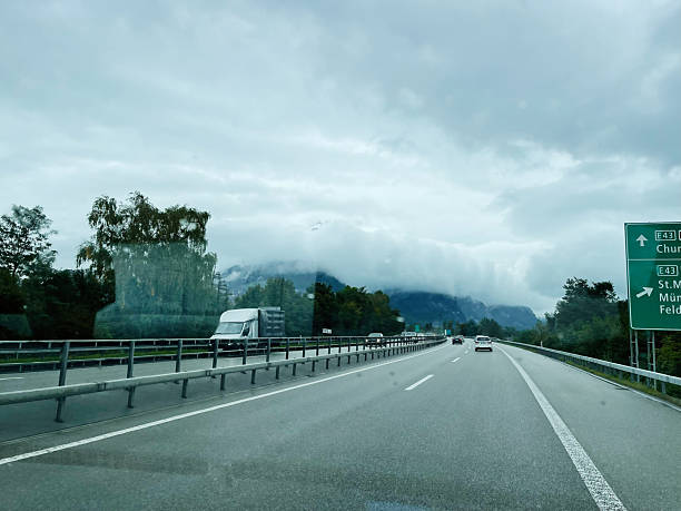 istock Scenic Highway View with Mountains and Clouds in Switzerland 2235871594