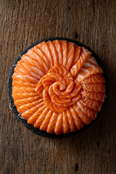 Fresh Salmon Sashimi Artfully Arranged on Dark Serving Board