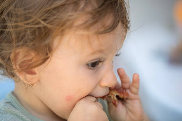 istock 2 years baby boy feeding 2235873865