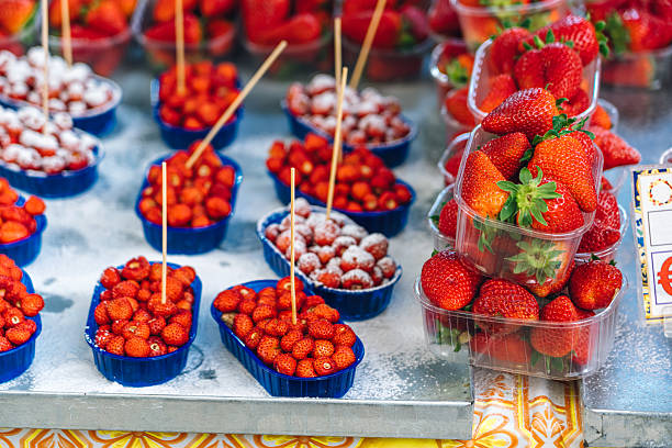 Fresh Strawberries and Wild Strawberries Displayed in Blue Containers