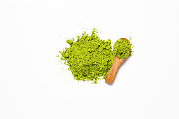 istock Top view green matcha tea powder isolated on white background 2235875611