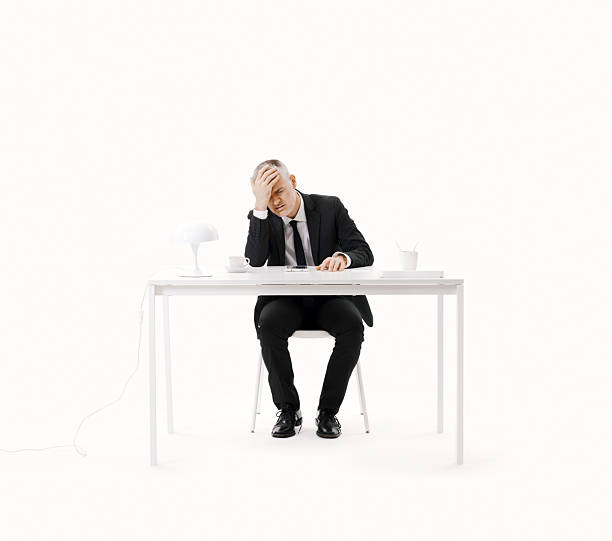 istock Depressed businessman suffering from headache 2235875776