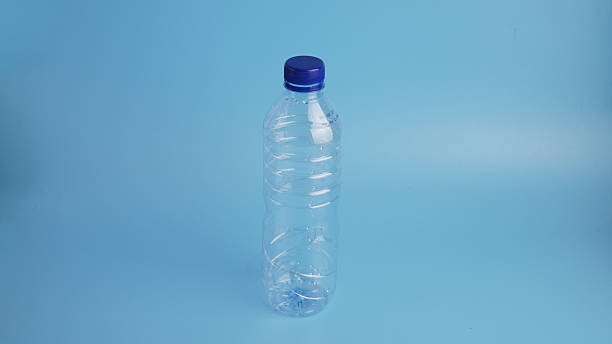 istock Plastic bottle of pure water, isolate on light blue background 2235879544