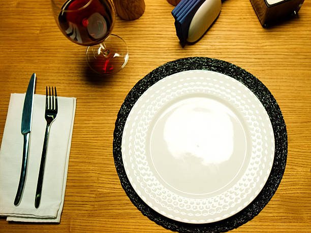 istock Beautiful table setting with empty white plate wooden table top view close up 2235881024