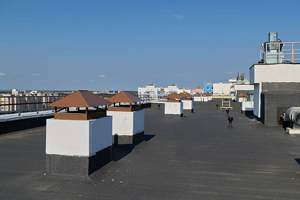 istock An Impressive Rooftop View Featuring Chimneys Set Against a Clear, Expansive Blue Sky 2235882399