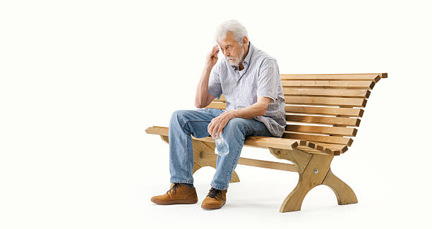istock Senior man sitting on a bench and suffering from the heat 2235883072