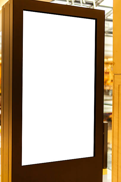 istock A blank digital display stand is positioned in a contemporary interior. The space is filled with warm lighting, creating an inviting atmosphere 2235888831