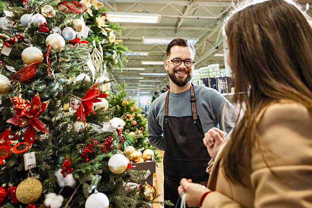 istock Happy female customer receiving service from shop assistant 2235890711