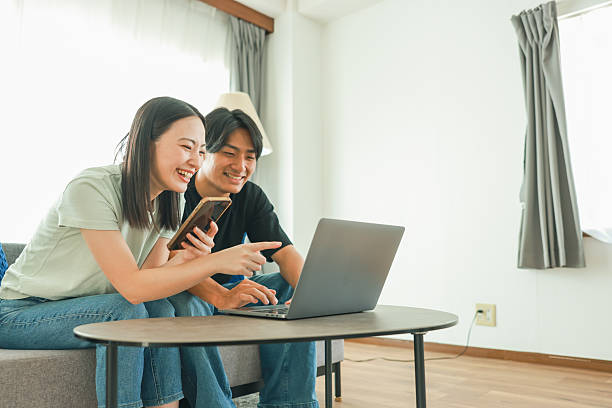istock Young Couple enjoy online shopping 2235892273