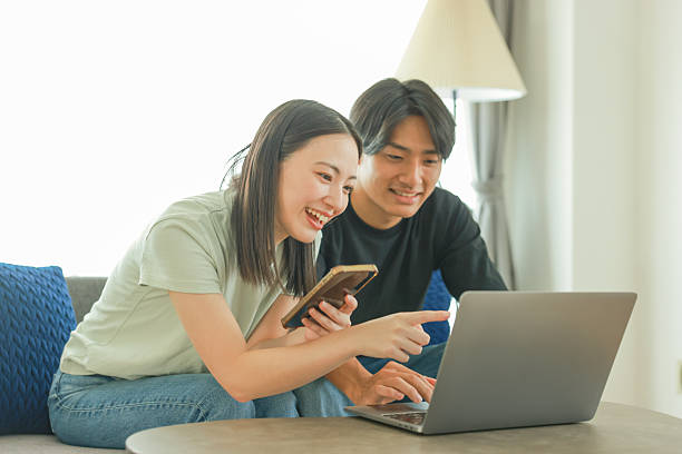 istock Young Couple enjoy online shopping 2235892280