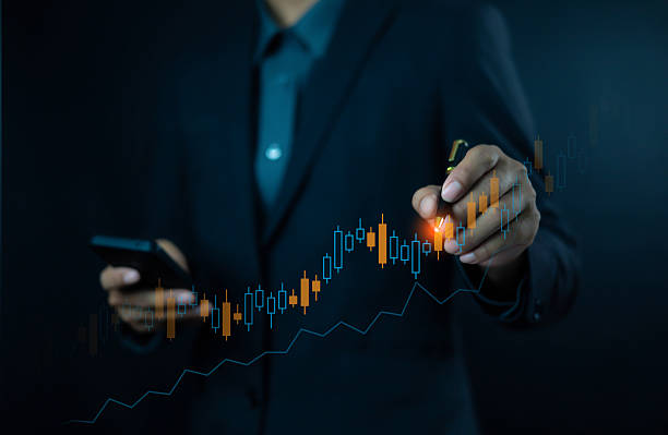 istock Businessman analyzing stock market chart with digital pen and mobile device, symbolizing trading, investment, financial growth, and modern business strategy in digital economy. 2235894345