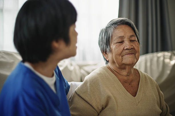 istock Elderly woman doing breathing exercises at home. 2235895919