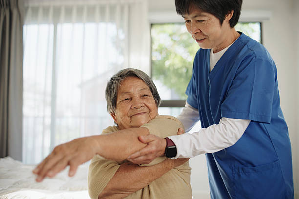 istock Elderly woman doing physical therapy with a professional therapist. 2235896775