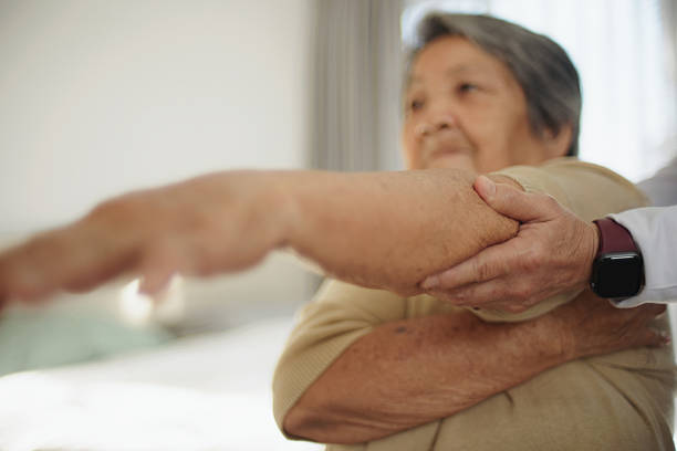 istock Elderly woman doing physical therapy with a professional therapist. 2235896796
