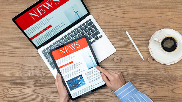 istock business woman using tablet pc for reading news 2235900540