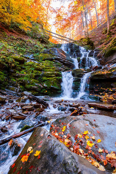 istock beautiful autumn landscape with waterfall shypit 2235901238