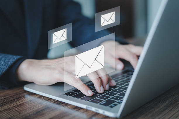 istock Businessman hands using Laptop typing keyboard on office table with email icon, email marketing concept, send or news letter, SMS marketing. Online working internet network. 2235901663