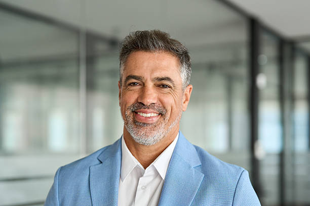 istock Confident happy older business man ceo leader looking at camera in office. 2235903625