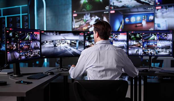 istock Elderly Security Guard Monitoring CCTV Feed 2235904787