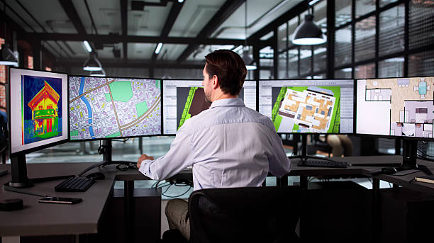 istock Elderly Man Uses Computer To Map Heat-insulating Properties 2235904796