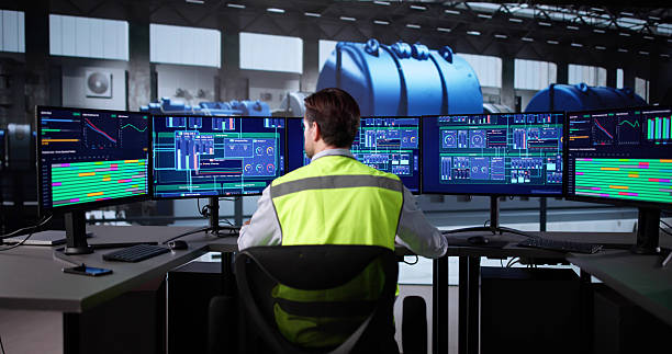 istock Elderly Engineer Monitoring Oil Power Plant SCADA System 2235904881