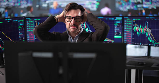 istock Financial Trader Anxiously Monitors Stock Market On Computer Screen 2235904930