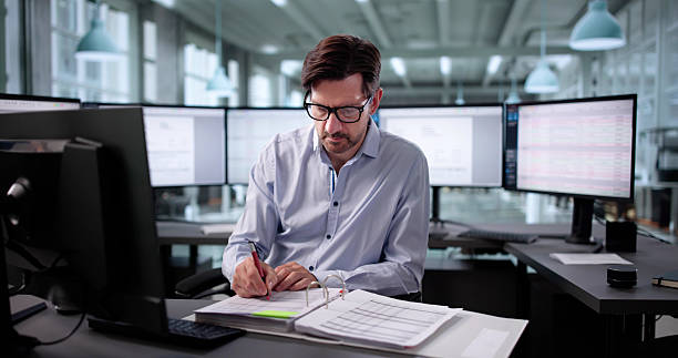 istock Senior Accountant Using Technical Software To Analyze Medical Invoices 2235904933