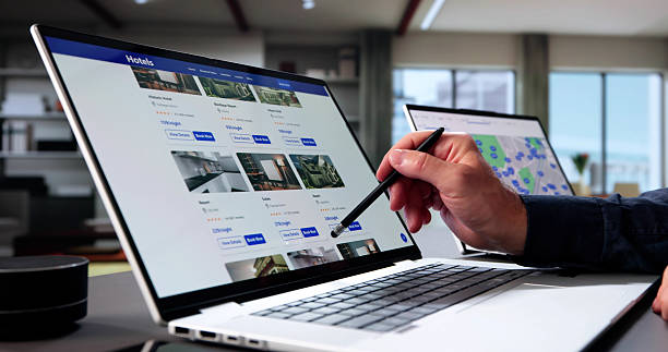 istock Elderly Man Booking Hotel Online With Discount 2235908778