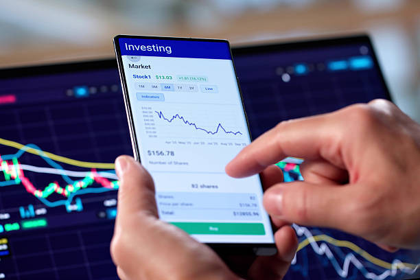 istock Senior Man Analyzing Stock Market Data On Mobile Phone App 2235908873