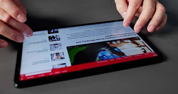 istock Man In Office Reading News Article 2235909107