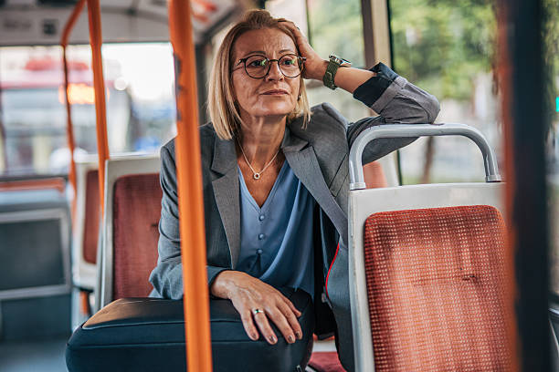 istock Businesswoman feeling tired and stressed while riding on a bus 2235909744