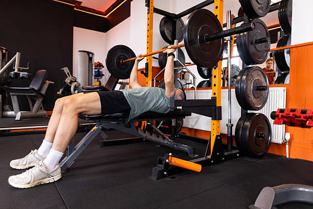 istock Determined Male Athlete Lifting Weights on Bench Press 2235911415