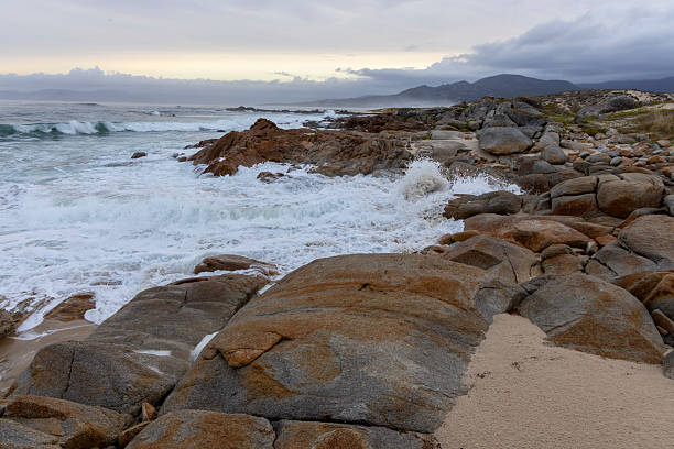 istock The ocean is crashing against the rocks, creating a powerful and dramatic scene 2235912672