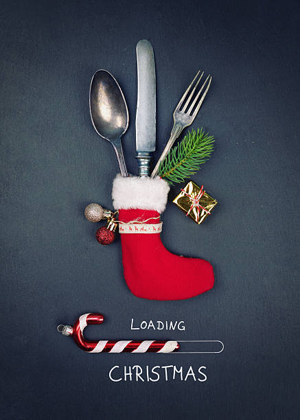 istock cutlery in a red Santa boot as a table setting for christmas diner 2235912850
