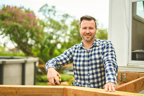 istock Handyman worker making patio outside close to a pool 2235912916