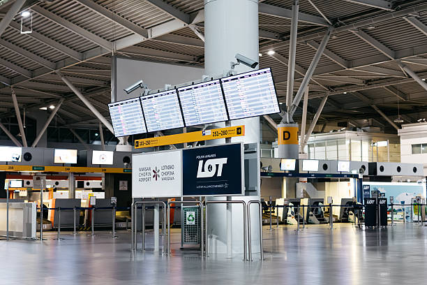 The airport's modern terminal features flight information boards and spacious seating areas, creating a vibrant environment for travelers.